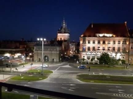 a view of a city at night with a building at Willa Oliwia in Gdańsk