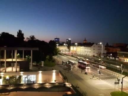 a city street at night with a bus at Willa Oliwia in Gdańsk