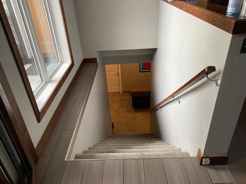 a staircase in a house with a window at Stay549 in Winnipeg