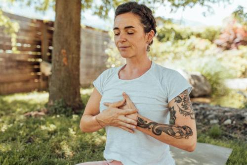 a woman with a snake tattoo on her arm at Biohotel theiner's garten in Lana