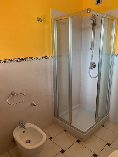 a bathroom with a shower and a toilet at il borghetto Bennie en Liisa in Cupra Marittima