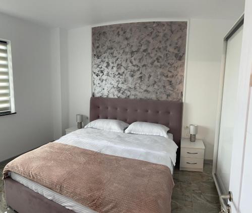 Postel nebo postele na pokoji v ubytování Apartament Paradis Eforie nord