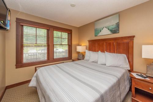 a bedroom with a large bed and a window at A208 One Bedroom Standard View in Oakland