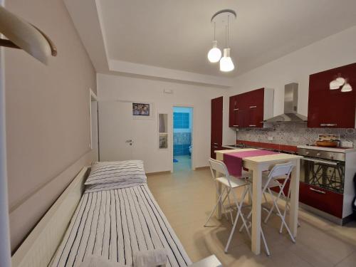 Kuchyň nebo kuchyňský kout v ubytování iMama' Rooms