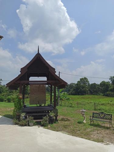 Κήπος έξω από το Darney's Homestay Kg Bangau Tanjung