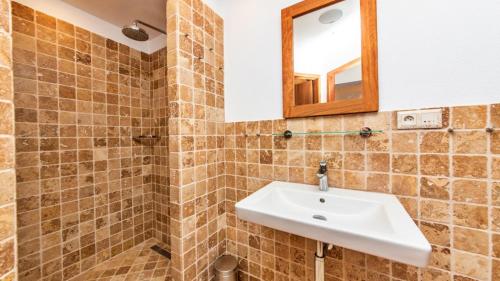 a bathroom with a sink and a mirror at Seaside resort Vasiliki in Vasiliki