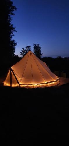 a tent is lit up in the dark at Apartmány Tollendorf Lužické hory in Jiřetín pod Jedlovou