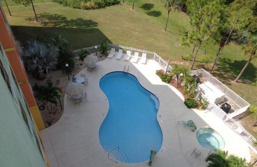 an overhead view of a swimming pool at a resort at Allure Suites of Fort Myers in Fort Myers