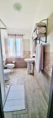Postel nebo postele na pokoji v ubytování B&B Torre Turrisi