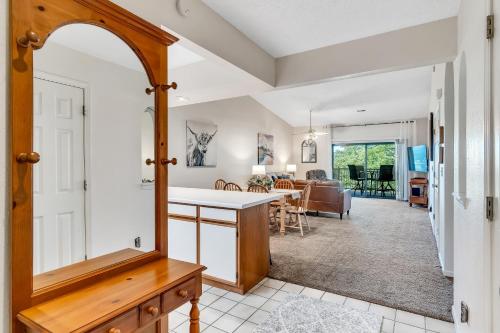 a kitchen and living room with a dining room at Suite Spot at the Foothills condo in Branson