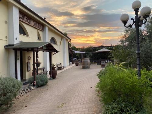 a building with a street light in front of it at Agriturismo San Michele in San Michele