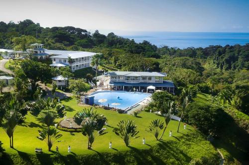 an aerial view of a large house with a swimming pool at Cristal Ballena Boutique Hotel & Spa in Uvita