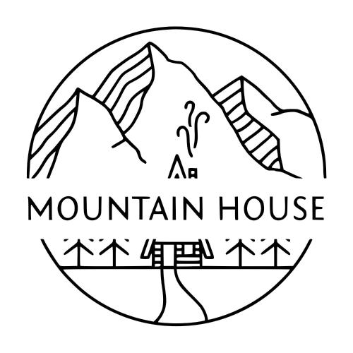 a mountain house logo with mountains in a circle at Mountain House in Ustrzyki Dolne