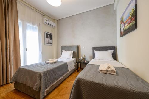 Postel nebo postele na pokoji v ubytování Athens city spot