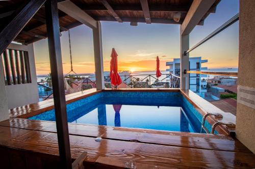 a swimming pool on the roof of a building at Residence Las Flores in La Paz