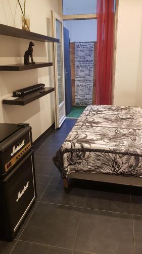 a bedroom with a bed in a room with a window at LOFT 100m2 in Toulon