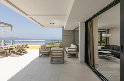 an open living room with a view of the ocean at Hotel Antonio in Makarska