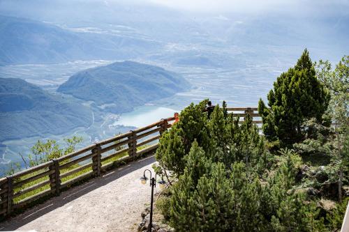 a view of a valley from the top of a mountain at PanoramaHotel Penegal in Mendola
