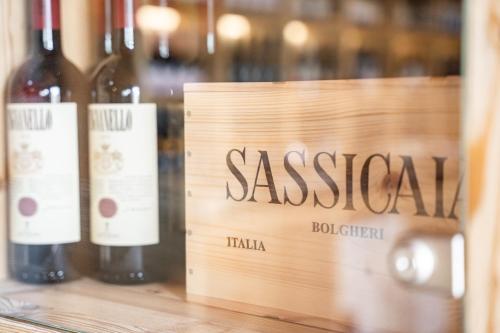 a wooden crate with three bottles of wine at PanoramaHotel Penegal in Mendola