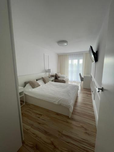Postel nebo postele na pokoji v ubytování Luksusowy Apartament na Wydmach Międzywodzie