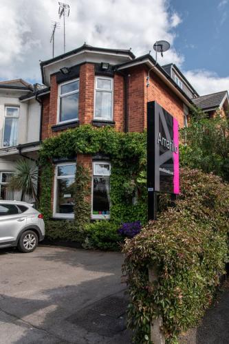 a house with a sign in front of it at Amarillo Guesthouse in Bournemouth