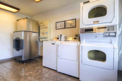 
a white refrigerator freezer sitting next to a white stove top oven at Motel 6-Las Vegas, NV - Boulder Hwy in Las Vegas

