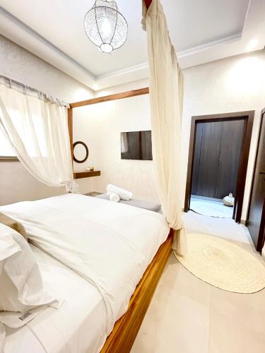 a bedroom with a bed and a window at Paradisiac and luxurious villa with private beach in Dakhla in Dakhla