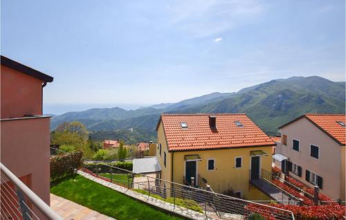 a view of a town with mountains in the background at Stunning Home In Magliolo in Magliolo