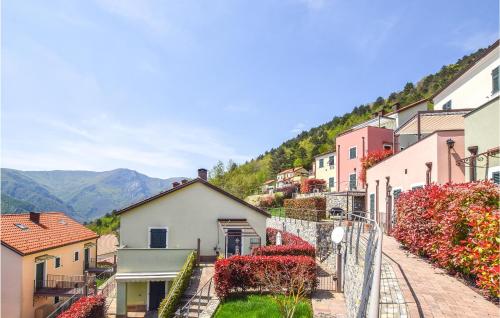 a street in a town with buildings and flowers at Stunning Home In Magliolo in Magliolo