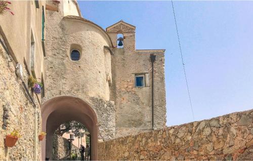 a building with a cross on the side of it at Stunning Home In Magliolo in Magliolo