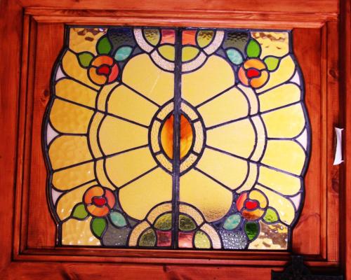 a stained glass window with oranges on it at Ramadale Stornoway in Stornoway