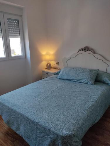Кровать или кровати в номере Agradable casa con patio