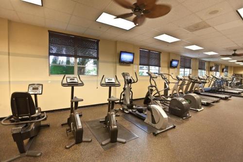 a gym with a bunch of cardio equipment in it at Sunny Isles Ocean Reserve Condo Apartments in Miami Beach