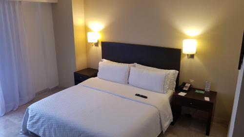 Voodi või voodid majutusasutuse Fiesta Inn Coatzacoalcos toas