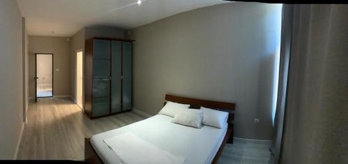 Łóżko lub łóżka w pokoju w obiekcie Apartman Vukoja