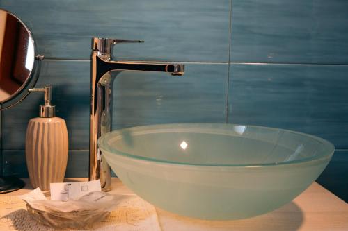 a bowl sink on a counter in a bathroom at Villa Dama luxury in Alghero