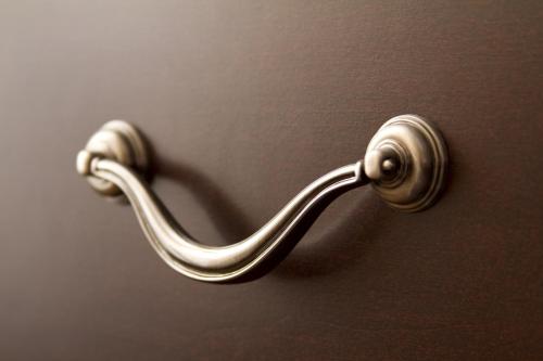 a metal door handle on a wooden door at Ayres Suites Yorba Linda/Anaheim Hills in Anaheim
