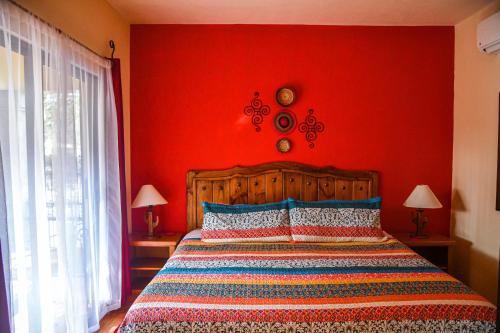 Tempat tidur dalam kamar di Hotel Casa Mangos Loreto