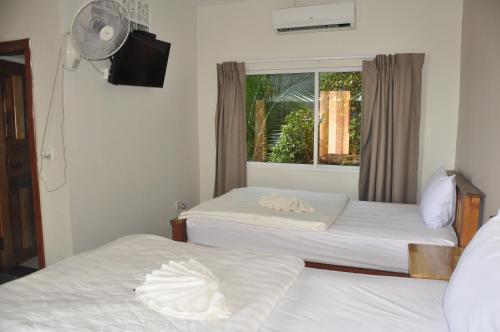 Postel nebo postele na pokoji v ubytování Sok Heng Guesthouse