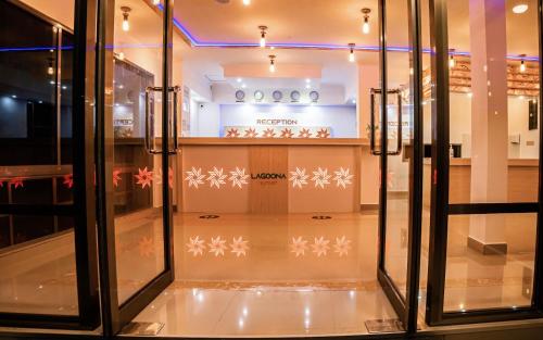 a store with glass doors and snowstals on the floor at Lagoona Sunset in Maafushi