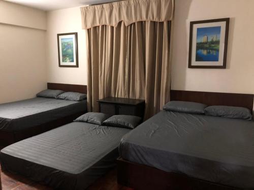 Un ou plusieurs lits dans un hébergement de l'établissement A'Famosa Apartment Villa D'Savoy
