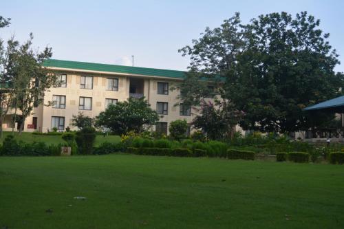 a building with a lawn in front of it at Vivanta Katra Vaishno Devi in Katra