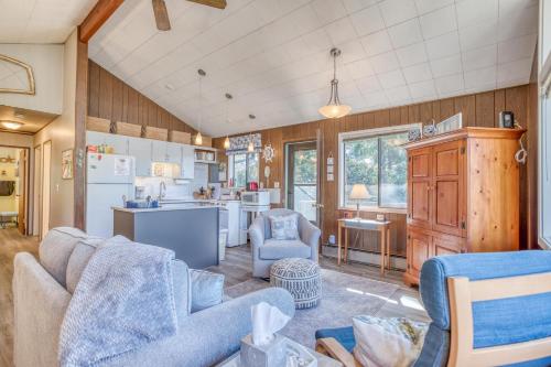 a living room with a couch and a kitchen at The Beach Cabin MCA 736 - Meredith Lodging in Manzanita