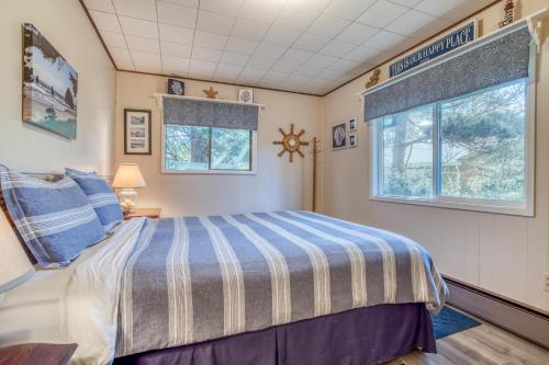 a bedroom with a bed and a window at The Beach Cabin MCA 736 - Meredith Lodging in Manzanita