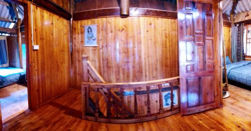 a wooden room with a sauna in a house at Surelee Homestay in Sa Pa