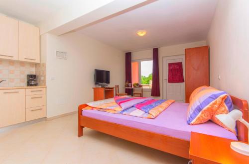 Postel nebo postele na pokoji v ubytování Apartments 4 Palme