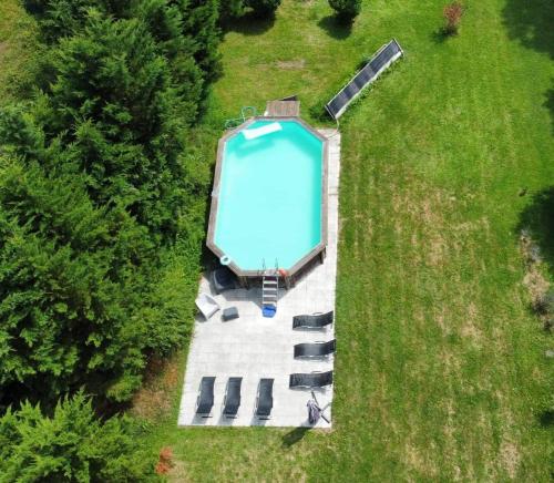 an overhead view of a swimming pool in the grass at Montplaisir in Montendre