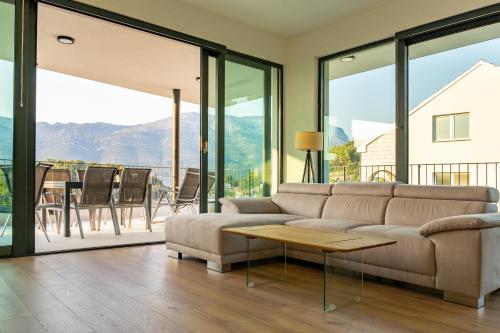 a living room with a couch and a table at Korcula Hill in Korčula