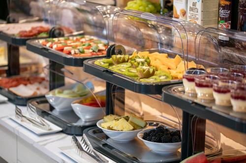 a buffet with many different types of food on display at Hotel Antonio in Makarska