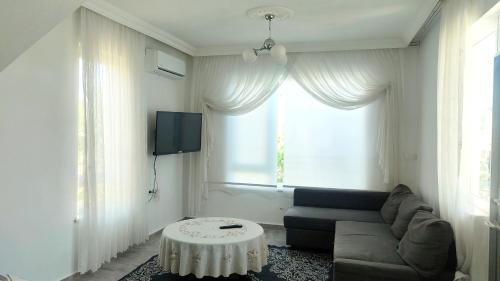 Posezení v ubytování Lux triplex villa in Antalya for families
